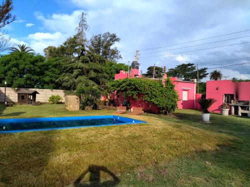 a backyard of a house with a swimming pool at Family Place II in Luján