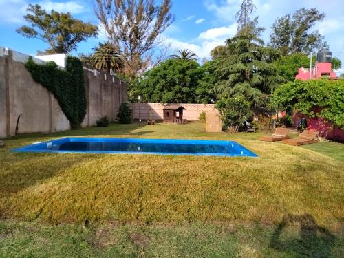 a swimming pool in the middle of a yard at Family Place II in Luján