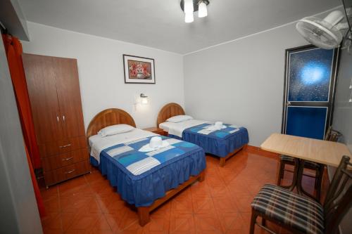 מיטה או מיטות בחדר ב-Hotel Mayros