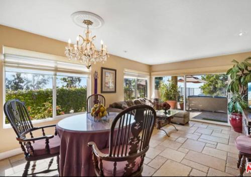 a large living room with a table and chairs at Lux Villa Ocean View Pool &Spa in Malibu