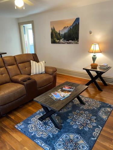 a living room with a couch and a coffee table at Cypress Hill in Ashland
