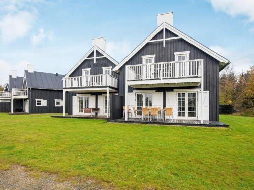 a large house with a large yard at Modern holiday home with sauna in Gjern