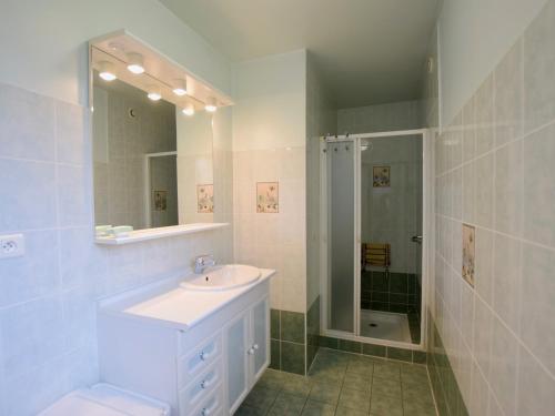 a white bathroom with a sink and a shower at Villa Publier, 5 pièces, 8 personnes - FR-1-498-24 in Publier