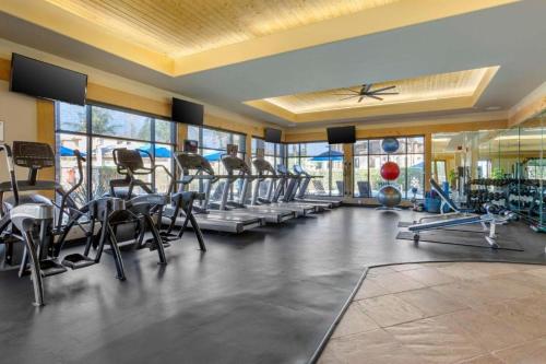 a gym with a lot of treadmills and machines at Scottsdale Links Resort in Scottsdale