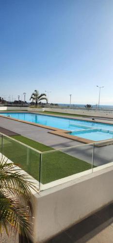 a large swimming pool on top of a building at ayllu in Arica