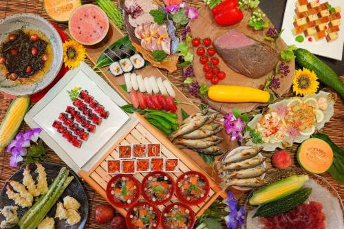 a table topped with lots of different types of food at Urabandai Lake Resort Geihinkan Nekoma Rikyu in Kitashiobara
