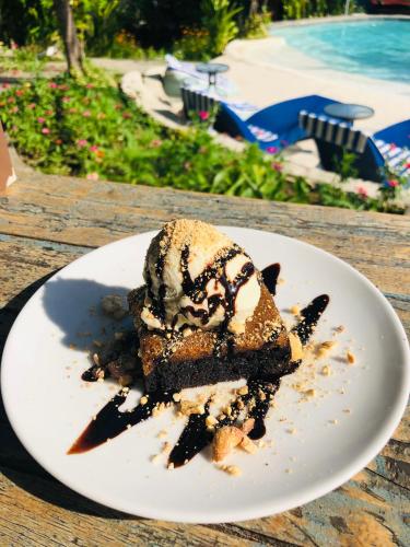 a piece of dessert on a plate on a table at Wae Molas Hotel in Labuan Bajo