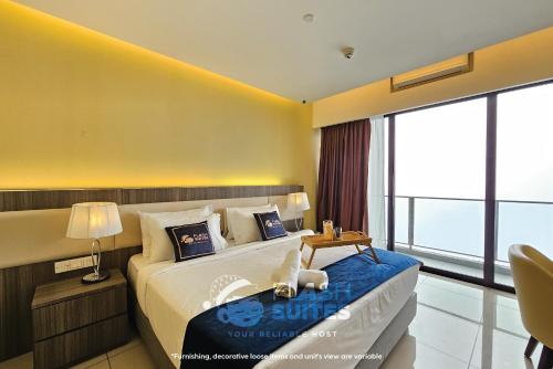 a bedroom with a large bed and a large window at Premium Suites D'lement At Genting Highlands in Genting Highlands