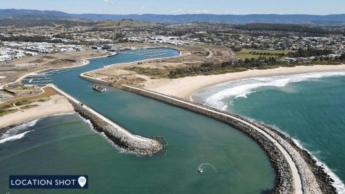 an aerial view of a beach and the ocean at Serendipity in Shellharbour