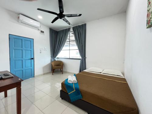 Postel nebo postele na pokoji v ubytování IBAI BEACH GUESTHOUSE