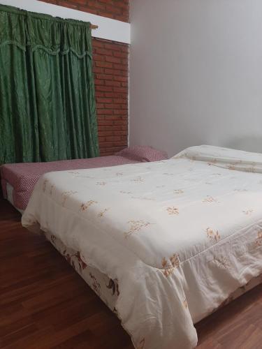 Кровать или кровати в номере Departamento La Mariposa