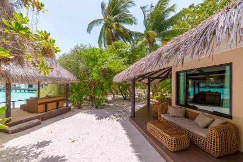 a villa on the beach with a view of the ocean at Kihaa Maldives in Baa Atoll