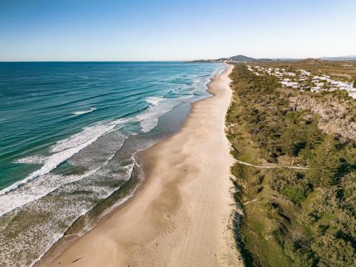 an aerial view of the ocean and a beach at Essence Peregian Beach Resort - Wallum 4 Bedroom Luxury Home in Peregian Beach