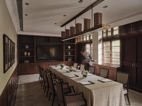 a large dining room with a long table and chairs at Capella Shanghai, Jian Ye Li in Shanghai