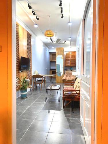 a living room with a table and a dining room at Azalea Apartment in Hanoi