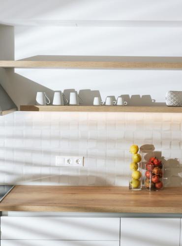 a kitchen with a wooden counter top with fruits on it at Luxury Villa Muse Calliope in Matala