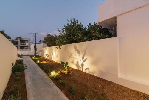 a wall with lights on the side of a building at Luxury Villa Muse Calliope in Matala