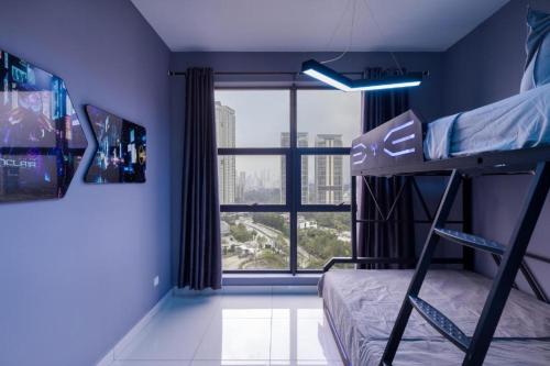 a bedroom with a bunk bed and a large window at Arena Gaming Suite In Arte Mont Kiara in Kuala Lumpur