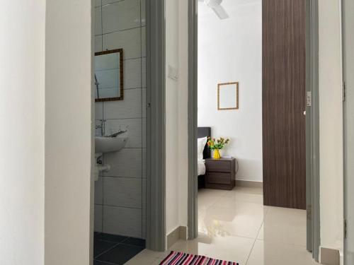 a bathroom with a sink and a mirror at Relax Bear Homestay in Tanah Rata