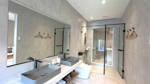 a bathroom with a sink and a mirror at 拾嶼SheWill in Hengchun