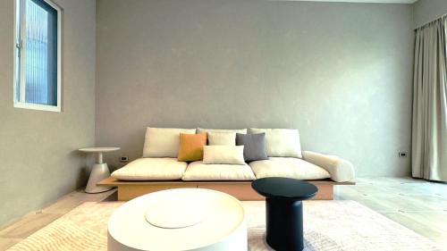 a living room with a couch and a table at 拾嶼SheWill in Hengchun