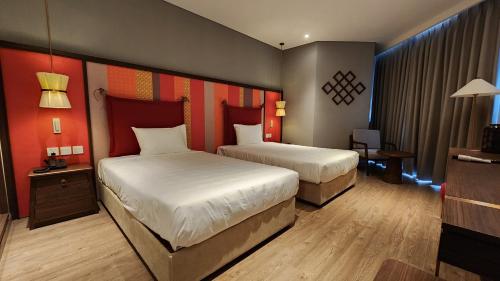 Ένα ή περισσότερα κρεβάτια σε δωμάτιο στο S1804 Apec Mandala Wyndham