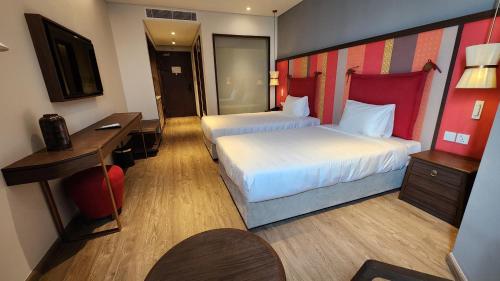 Ένα ή περισσότερα κρεβάτια σε δωμάτιο στο S1804 Apec Mandala Wyndham