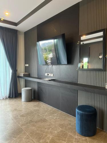 a bathroom with a sink and a mirror at Baan Fran Sim Da in Bang Tao Beach