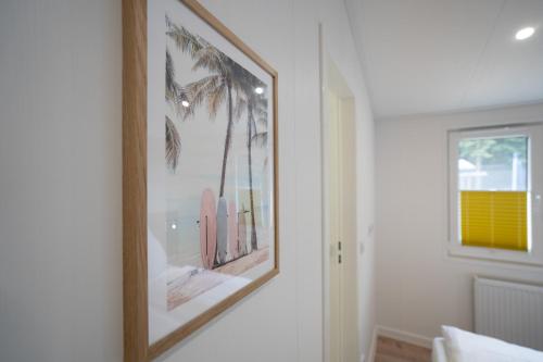 Ένα μπάνιο στο Ostseecamp Ferienhaus "Palm Beach"