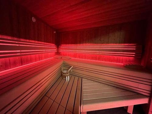 a red empty bench in a bowling alley at Pension Edelweiß in Sankt Johann im Pongau