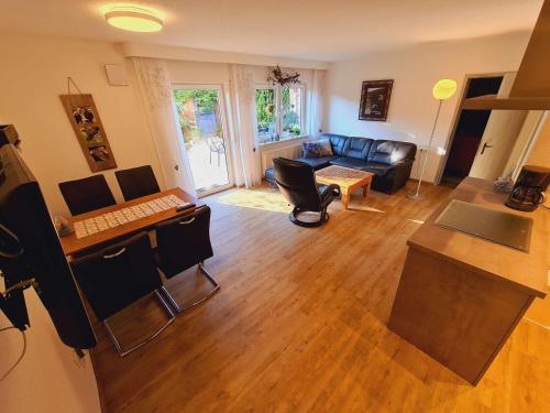a living room with a couch and a table at Ferienwohnungen Golla-lang in Oberharmersbach