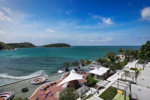 an aerial view of the beach and the ocean at The Nai Harn in Nai Harn Beach