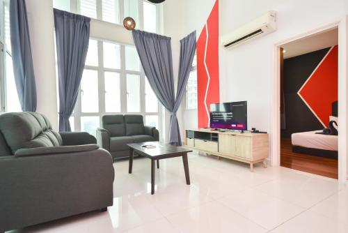 a living room with a couch and a tv at 1Medini Theme Suite by Nest Home【LEGOLAND】 in Nusajaya