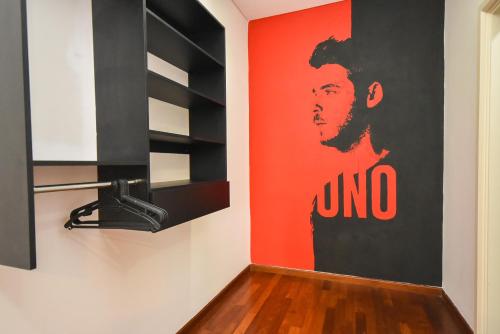 a room with a poster ofgangsta rap artist on the wall at 1Medini Theme Suite by Nest Home【LEGOLAND】 in Nusajaya