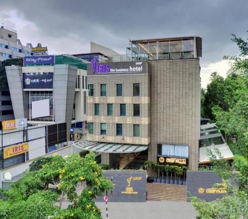 a building in the middle of a city at Iris The Business Hotel in Bengaluru