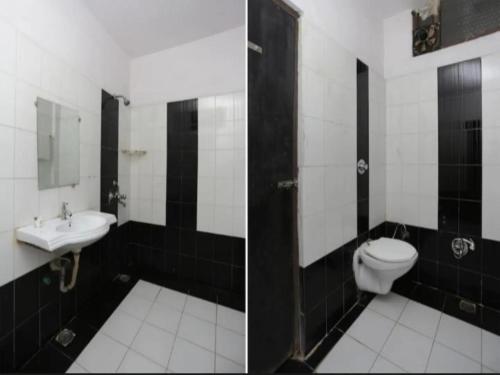 a bathroom with a toilet and a sink at Hotel Jagdish in Raipur