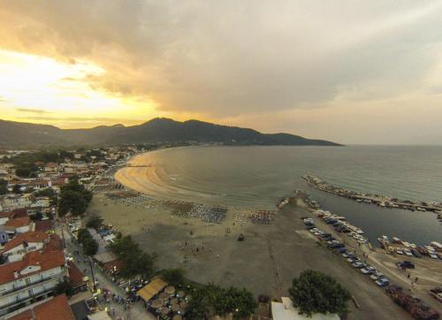 an aerial view of a beach with cars parked at Ntinas Filoxenia Hotel & Spa in Skala Potamias