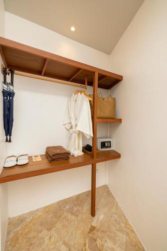 a room with wooden shelves on the wall at The AVA Resort Koh Tao in Koh Tao
