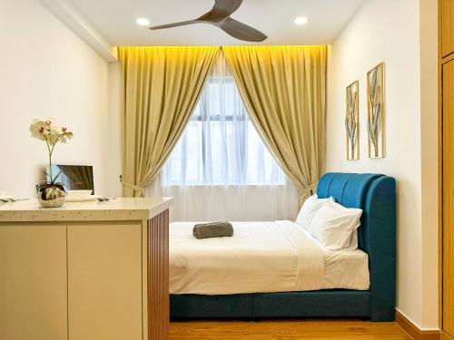 a bedroom with a bed with a blue headboard and a window at Twin Tower Residence by Nest Home【5 mins walk to CIQ】 in Johor Bahru