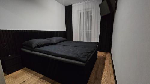 Легло или легла в стая в Moja Klonowa - apartament z sypialnią, parking