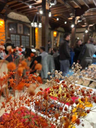 a group of people standing around a table with flowers at Giritligil Hotel in Manisa