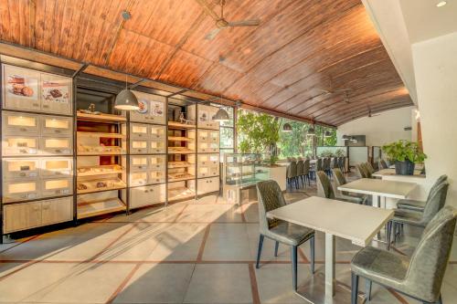 a dining room with a table and chairs at The SSK Solitaire Hotel & Banquets in Nashik