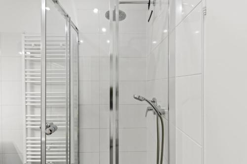 a shower with a glass door in a bathroom at 5 Bedrooms - 143 m² - Near Main Station in Vienna