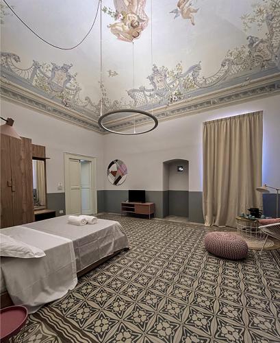 Giường trong phòng chung tại B&B Palazzo 1906 - Eco dimora storica