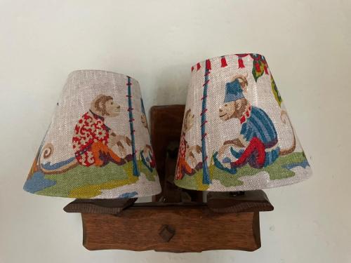 two towels with bears on them on a wooden shelf at The Totnes Guest House. Upstairs at Zappa's in Totnes