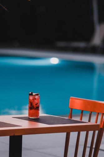 a candle sitting on a table next to a pool at Luxury Villa Muse Calliope in Matala