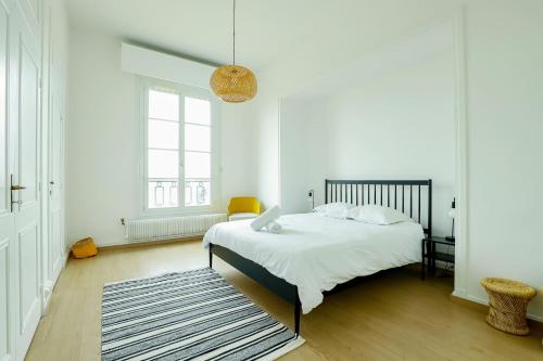 מיטה או מיטות בחדר ב-Fac 6 - Vue Garonne - Tram - Parking