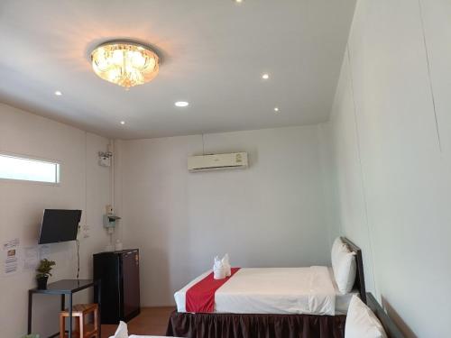 Postel nebo postele na pokoji v ubytování โรงแรมแอมไอม่อน - Am Amoonds Hotel