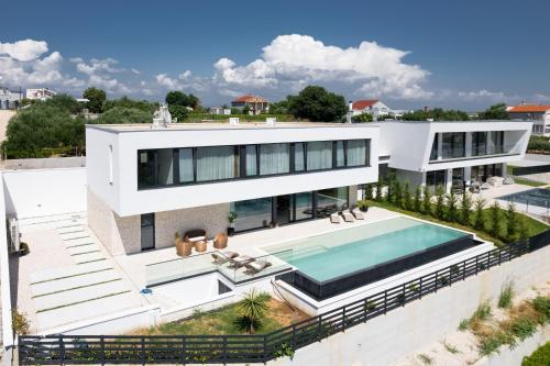 an aerial view of a house with a swimming pool at Villa Aurum ZadarVillas in Zadar