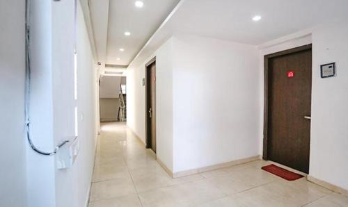 an empty hallway with a door in a building at FabExpress Premium Room I in New Delhi